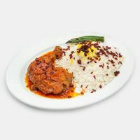 زرشک پلو با مرغ سرخ شده مجلسی (ران)